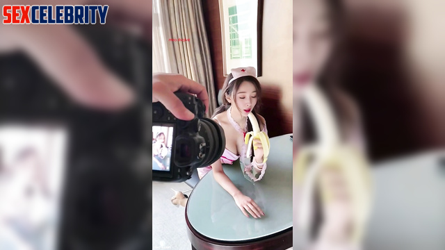 Chinese Yang Mi (中国人杨幂) as a nurse eats a banana 护士吃香蕉 [PREMIUM]